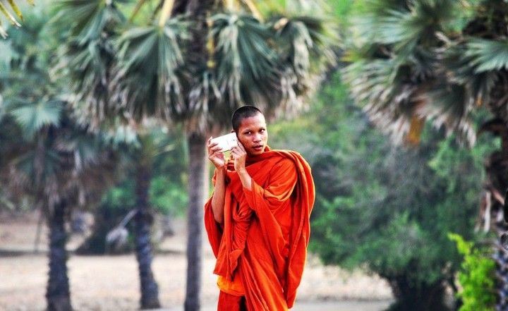 Cambodian monk with cell phone
